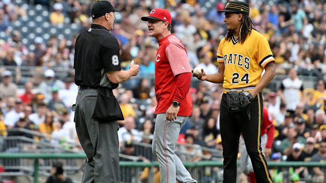 PITTSBURGH, PA - APRIL 07: David Bell #25 of the Cincinnati Reds argues with umpire Jeff Kellogg #8 as Chris Archer #24 of the Pittsburgh Pirates looks on in the fourth inning during the game at PNC Park on April 7, 2019 in Pittsburgh, Pennsylvania.
