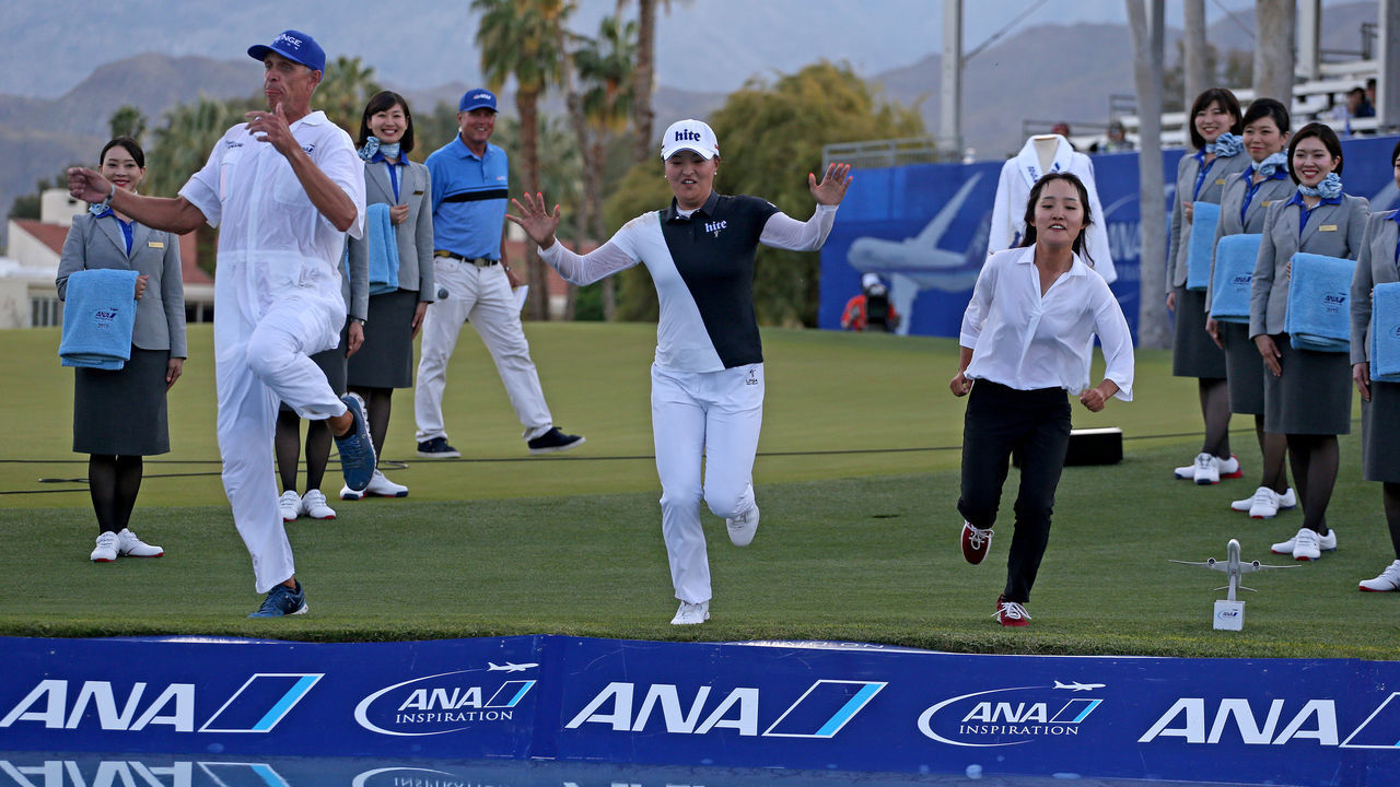 RANCHO MIRAGE, CALIFORNIA - APRIL 07: Jin Young Ko jumps into Poppies Pond with her caddie, David Brooker, and agent, Soo Jin Choi, after winning the ANA Inspiration on the Dinah Shore course at Mission Hills Country Club on April 07, 2019 in Rancho Mirage, California.