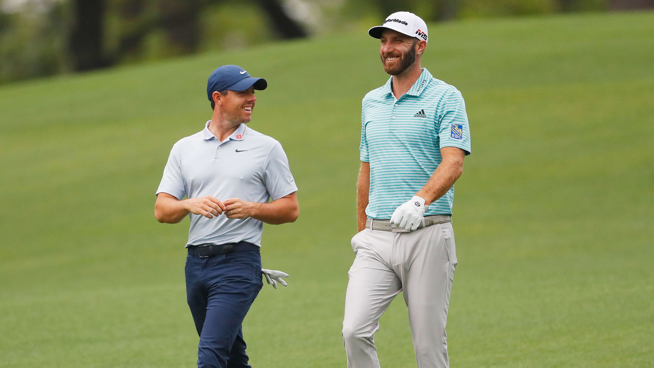 AUGUSTA, GEORGIA - APRIL 08: Rory McIlroy of Northern Ireland and Dustin Johnson of the United States share a laugh during a practice round prior to The Masters at Augusta National Golf Club on April 08, 2019 in Augusta, Georgia.