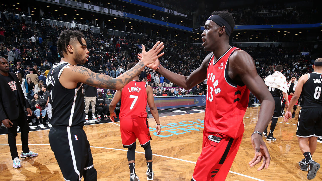 BROOKYLN, NY - APRIL 3: D'Angelo Russell #1 of the Brooklyn Nets hi-fives Pascal Siakam #43 of the Toronto Raptors after the game on April 3, 2019 at Barclays Center in New York City, New York. Mandatory Copyright Notice: Copyright 2019 NBAE