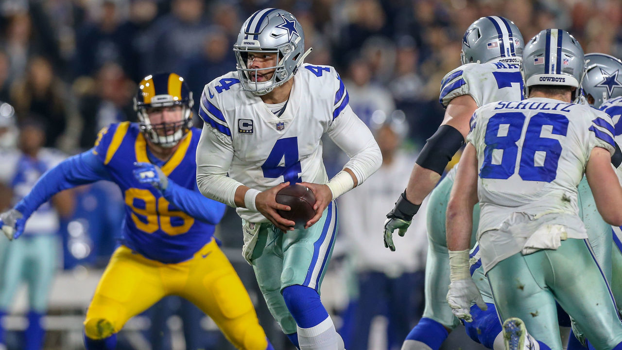 LOS ANGELES, CA - JANUARY 12: Dallas Cowboys quarterback Dak Prescott (4) looks to hand off the ball during the NFC Divisional Football game between the Dallas Cowboys and the Los Angeles Rams on January 12, 2019 at the Los Angeles Memorial Coliseum in Los Angeles, CA.