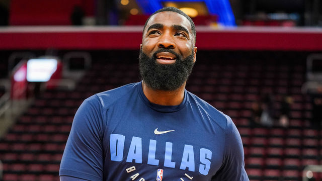 DETROIT, MICHIGAN - JANUARY 31: Assistant Coach God Shamgod of the Dallas Mavericks smiles before a game against the Detroit Pistons at Little Caesars Arena on January 31, 2019 in Detroit, Michigan.