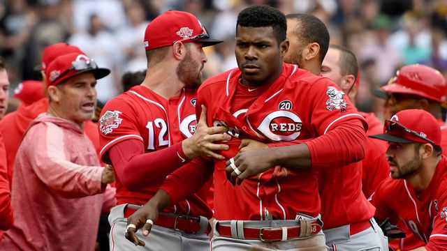 PITTSBURGH, PA - APRIL 07: Yasiel Puig #66 of the Cincinnati Reds is restrained by Matt Kemp #27 after benches clear in the fourth inning during the game against the Pittsburgh Pirates at PNC Park on April 7, 2019 in Pittsburgh, Pennsylvania.