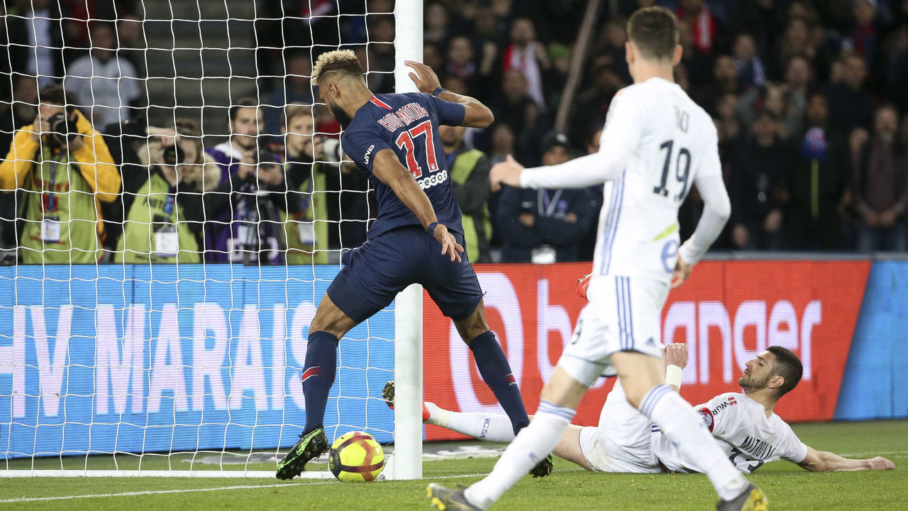 PARIS, FRANCE - APRIL 7: Eric Maxim Choupo-Moting of PSG stops the ball on the goal line, preventing inadvertently the goal of Christopher Nkunku of PSG during the French Ligue 1 match between Paris Saint-Germain (PSG) and RC Strasbourg Alsace at Parc des Princes stadium on April 7, 2019 in Paris, France.