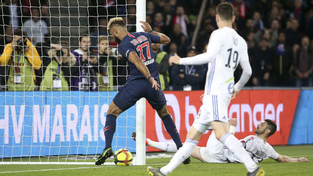 PARIS, FRANCE - APRIL 7: Eric Maxim Choupo-Moting of PSG stops the ball on the goal line, preventing inadvertently the goal of Christopher Nkunku of PSG during the French Ligue 1 match between Paris Saint-Germain (PSG) and RC Strasbourg Alsace at Parc des Princes stadium on April 7, 2019 in Paris, France.