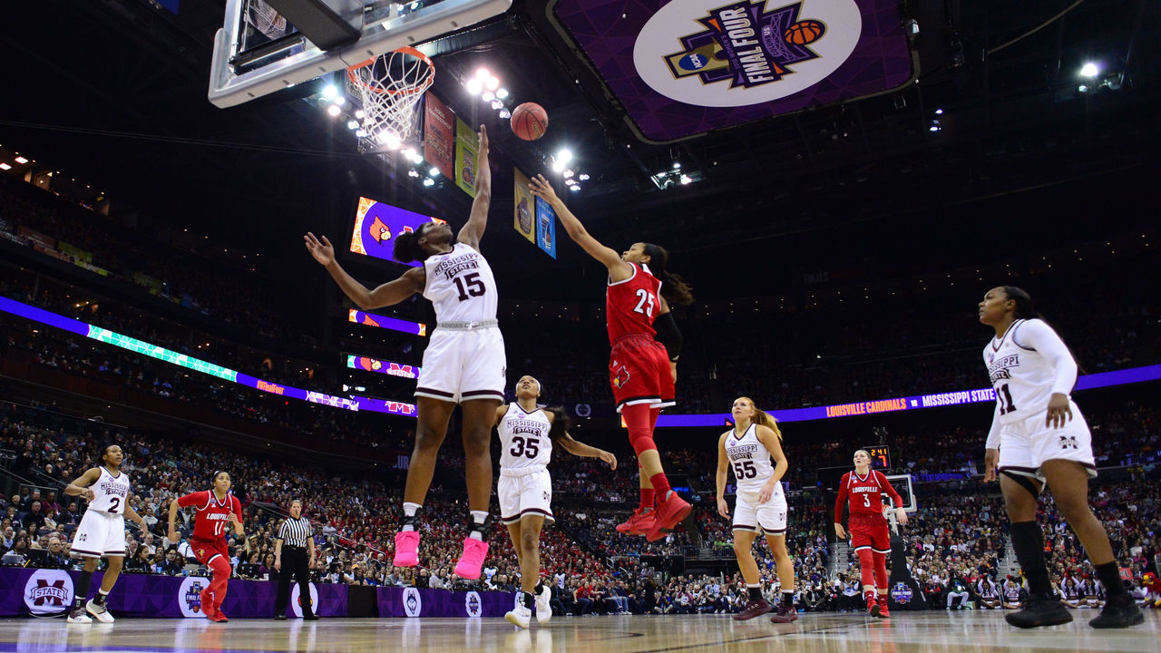 COLUMBUS, OH - MARCH 30: Asia Durr #25 of the Louisville Cardinals shoots over Teaira McCowan #15 of the Mississippi State Bulldogs during a semifinal game of the 2018 NCAA Division I Women's Basketball Final Four at Nationwide Arena on March 30, 2018 in Columbus, Ohio.