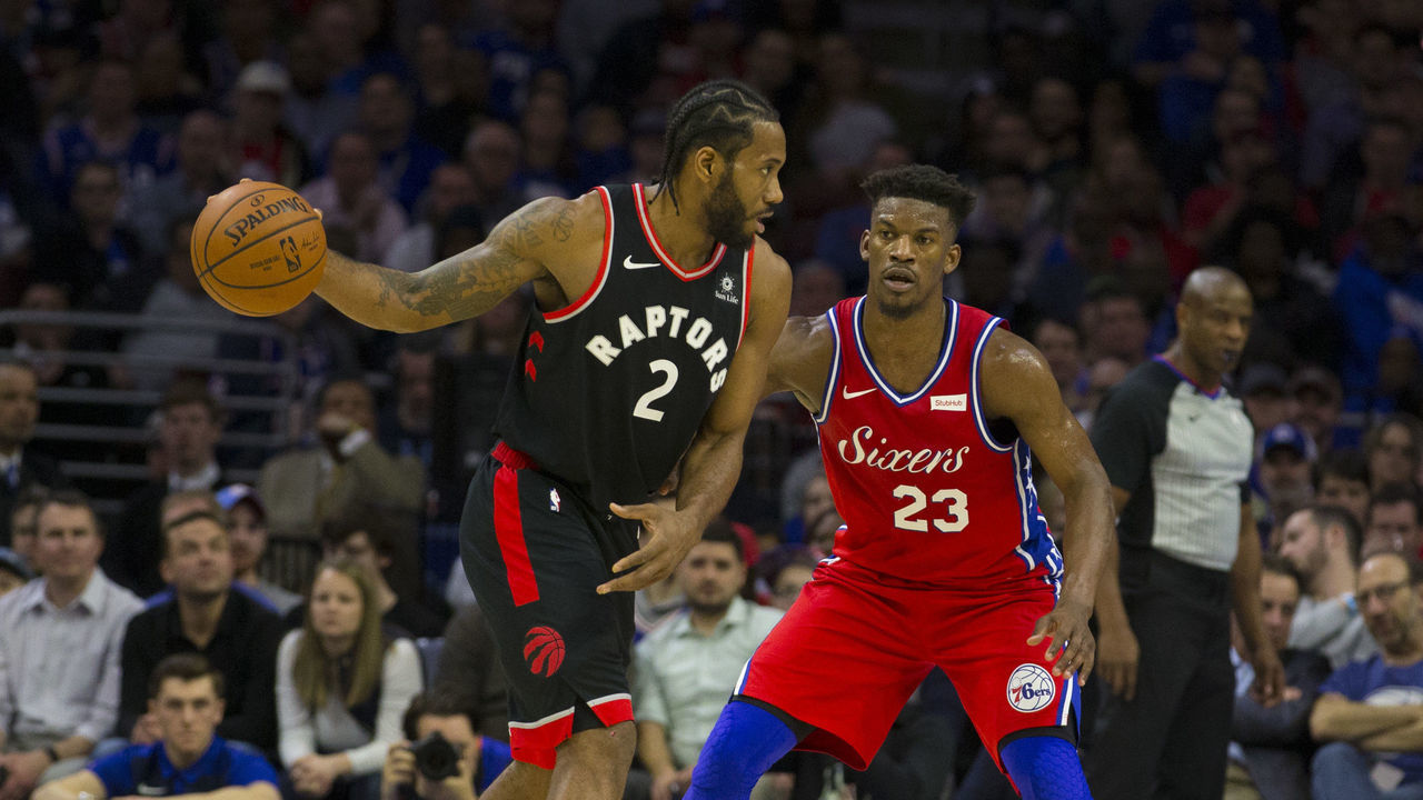 PHILADELPHIA, PA - FEBRUARY 05: Kawhi Leonard #2 of the Toronto Raptors controls the ball against Jimmy Butler #23 of the Philadelphia 76ers at the Wells Fargo Center on February 5, 2019 in Philadelphia, Pennsylvania. The Raptors defeated the 76ers 119-107.