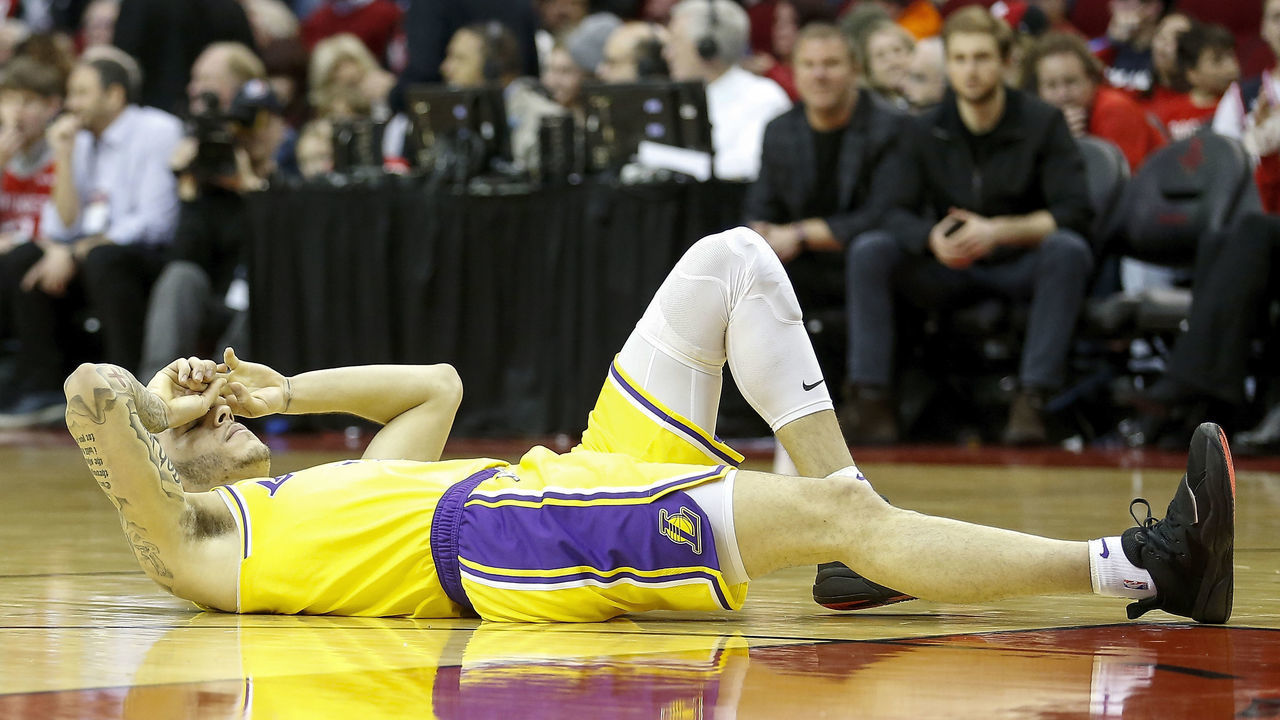 HOUSTON, TX - JANUARY 19: Lonzo Ball #2 of the Los Angeles Lakers lays on the court after an injury in the second half against the Houston Rockets at Toyota Center on January 19, 2019 in Houston, Texas.