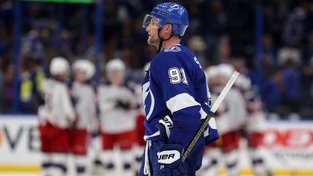 TAMPA, FL - APRIL 10: Steven Stamkos #91 of the Tampa Bay Lightning reacts as members of the Columbus Blue Jackets celebrate at the end of Game One of the Eastern Conference First Round during the 2019 NHL Stanley Cup Playoffs at Amalie Arena on April 10, 2019 in Tampa, Florida.