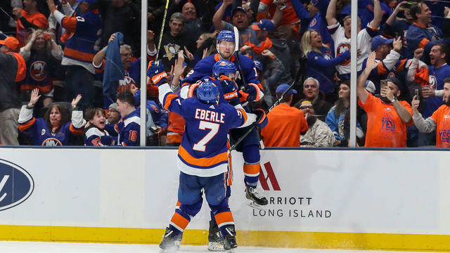 UNIONDALE, NY - APRIL 10: Overtime game winning goal scorer New York Islanders right wing Josh Bailey (12) is swarmed by New York Islanders right wing Jordan Eberle (7) and New York Islanders defenseman Ryan Pulock (6) during Game 1 of the First Round of the Stanley Cup Playoffs between the New York Islanders and Pittsburgh Penguins on April 10, 2019 at the Nassau Veterans Memorial Coliseum (NYCBLive) in Uniondale, NY.