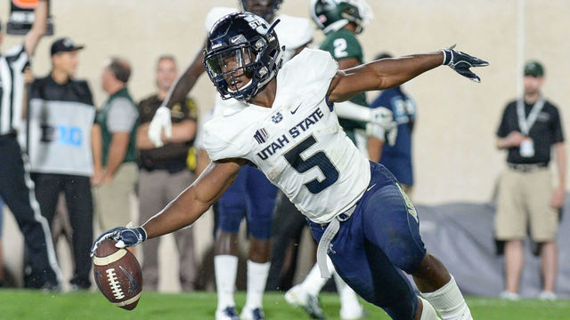 EAST LANSING, MI - AUGUST 31: Utah State Aggies running back Darwin Thompson (5) celebrates a fourth quarter touchdown during a non-conference college football game between Michigan State and Utah State on August 31, 2018, at Spartan Stadium in East Lansing, MI.