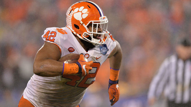 CHARLOTTE, NC - DECEMBER 01: Christian Wilkins #42 of the Clemson Tigers runs the ball against the Pittsburgh Panthers in the second quarter during their game at Bank of America Stadium on December 1, 2018 in Charlotte, North Carolina.