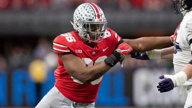 INDIANAPOLIS, IN - DECEMBER 01: Ohio State Buckeyes defensive tackle Dre'Mont Jones (86) rushes in against Northwestern Wildcats offensive lineman J.B. Butler (59) during the Big 10 Championship game between the Northwestern Wildcats and Ohio State Buckeyes on December 1, 2018, at Lucas Oil Stadium in Indianapolis, IN.