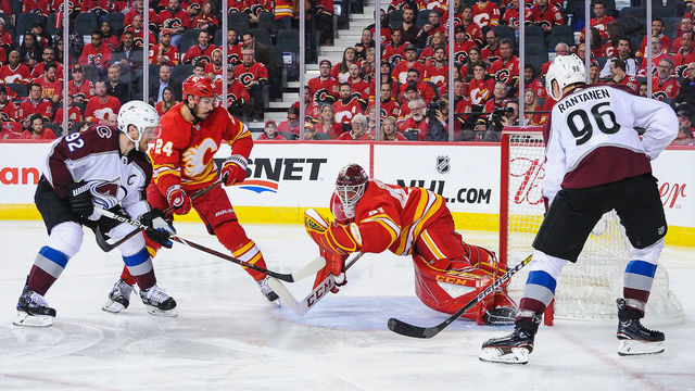 CALGARY, AB - APRIL 11: Mike Smith #41 of the Calgary Flames makes a glove save on a shot from Gabriel Landeskog #92 of the Colorado Avalanche in Game One of the Western Conference First Round during the 2019 NHL Stanley Cup Playoffs at Scotiabank Saddledome on March 15, 2019 in Calgary, Alberta, Canada.