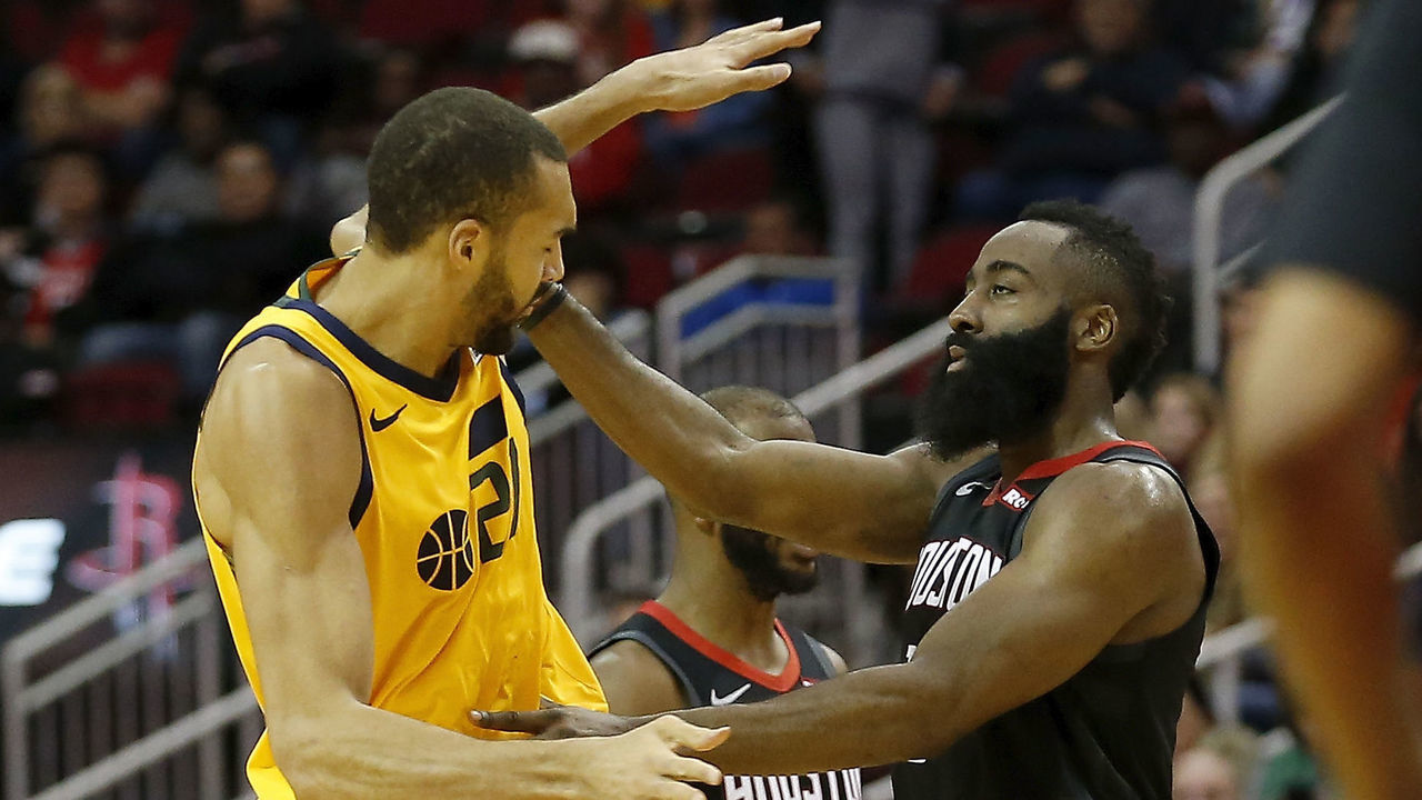 HOUSTON, TX - DECEMBER 17: James Harden #13 of the Houston Rockets pushes Rudy Gobert #27 of the Utah Jazz in the second half at Toyota Center on December 17, 2018 in Houston, Texas.