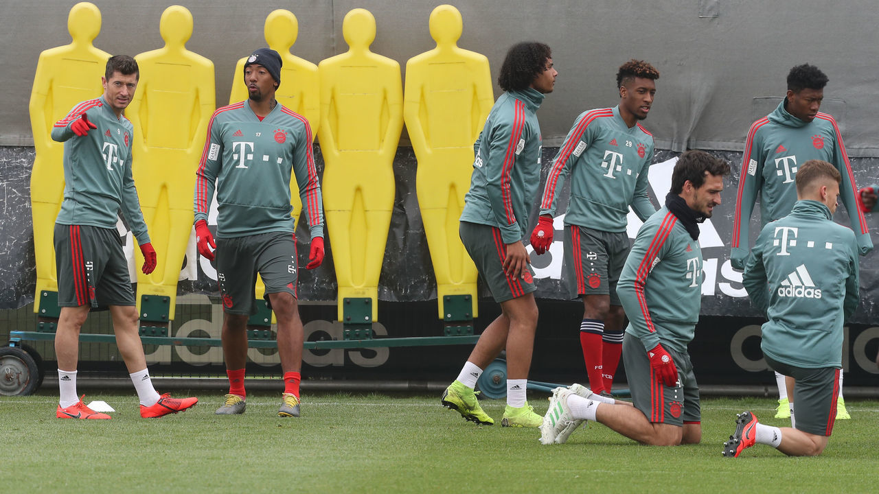 MUNICH, GERMANY - APRIL 12: (EXCLUSIVE COVERAGE) Robert Lewandowski, Jerome Boateng, Joshua Zirkzee, Kingsley Coman, Mats Hummels, David Alaba and Joshua Kimmich (L-R) of FC Bayern Muenchen warm up during a training session at the club's Saebener Strasse training ground on April 12, 2019 in Munich, Germany.