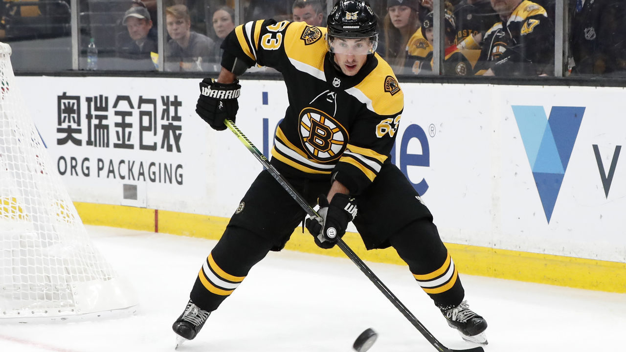 BOSTON, MA - MARCH 07: Boston Bruins left wing Brad Marchand (63) plays the puck during a game between the Boston Bruins and the Florida Panthers on March 7, 2019, at TD Garden in Boston, Massachusetts.
