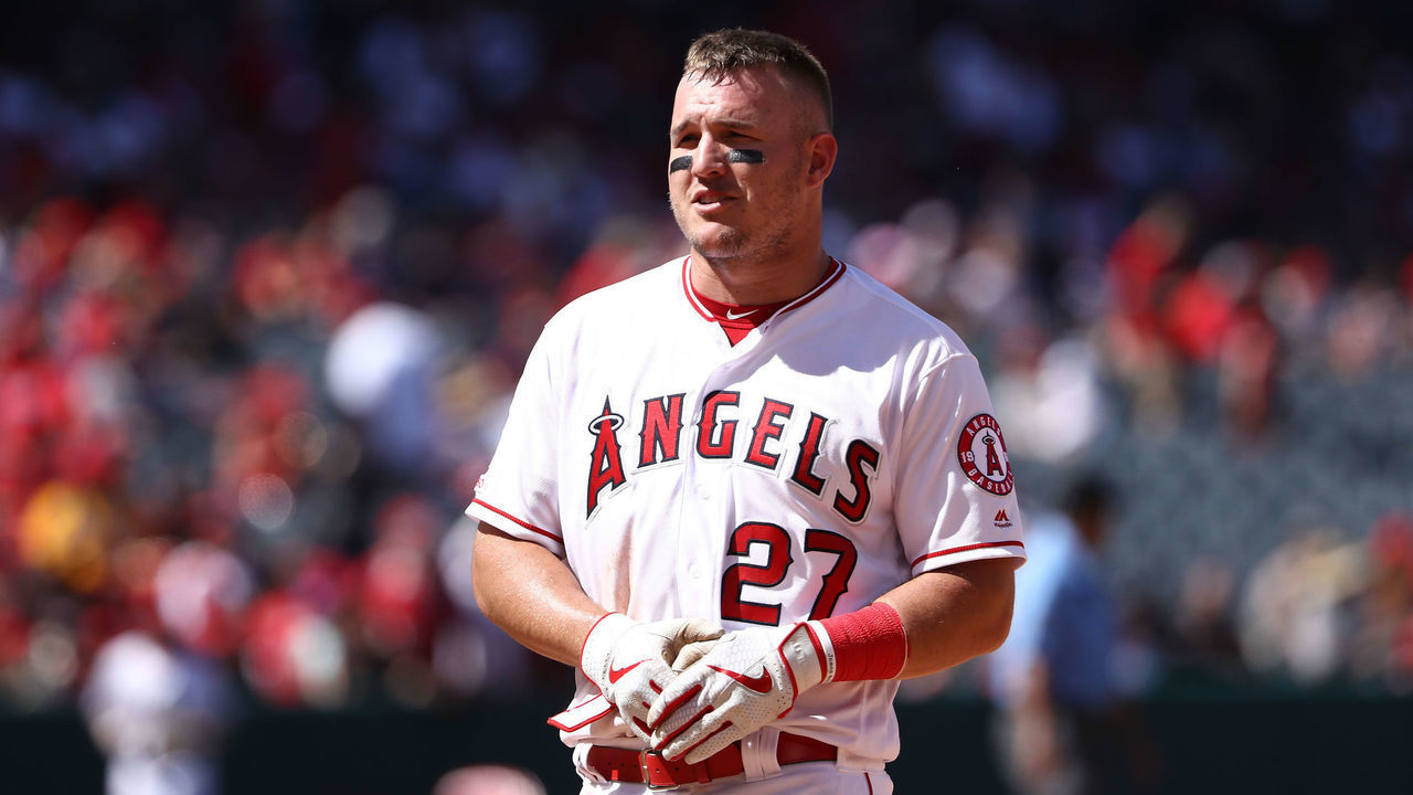 ANAHEIM, CALIFORNIA - APRIL 07: Mike Trout #27 of the Los Angeles Angels of Anaheim talks to Elvis Andrus #1 of the Texas Rangers after the fourth inning of the MLB game at Angel Stadium of Anaheim on April 07, 2019 in Anaheim, California. The Angels defeated the Rangers 7-2.