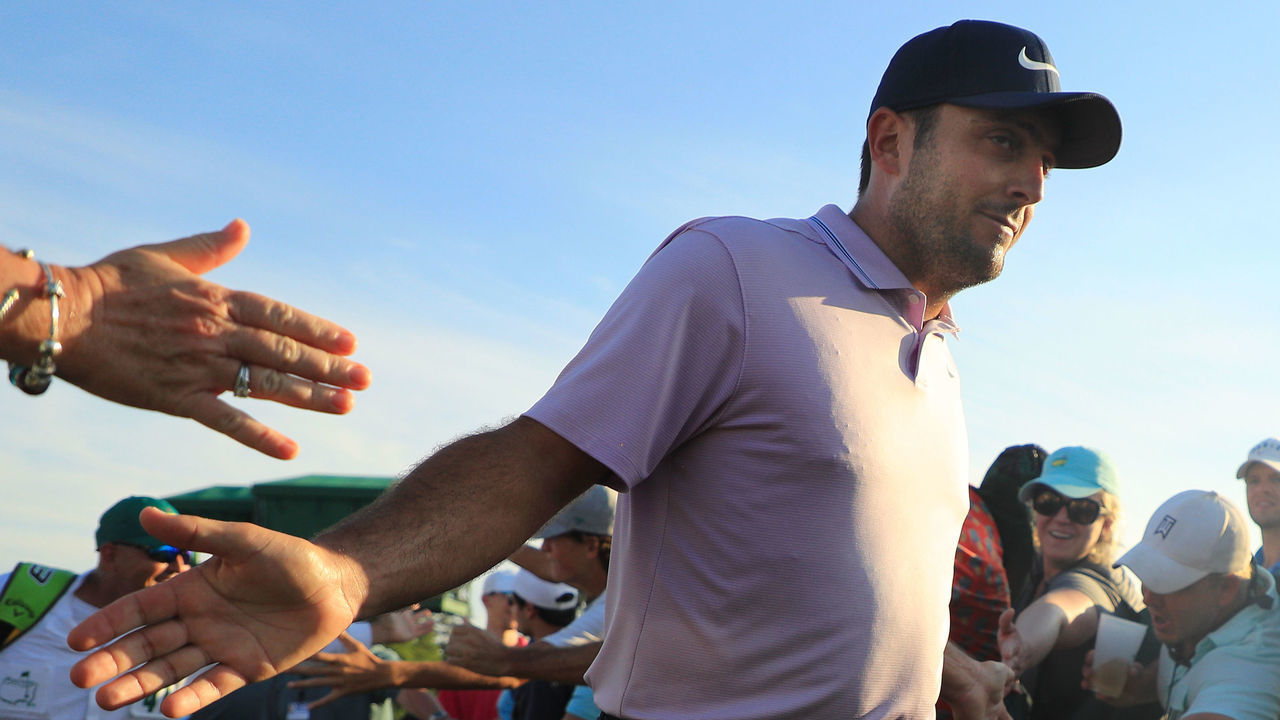AUGUSTA, GEORGIA - APRIL 13: Francesco Molinari of Italy high fives patrons as he walks off the 18th green during the third round of the Masters at Augusta National Golf Club on April 13, 2019 in Augusta, Georgia.