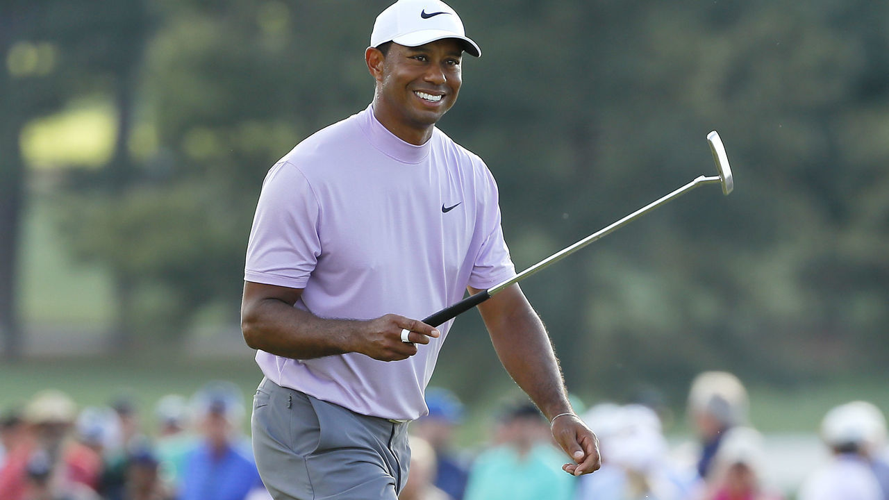 AUGUSTA, GEORGIA - APRIL 13: Tiger Woods of the United States smiles as he walks on the 18th hole during the third round of the Masters at Augusta National Golf Club on April 13, 2019 in Augusta, Georgia.
