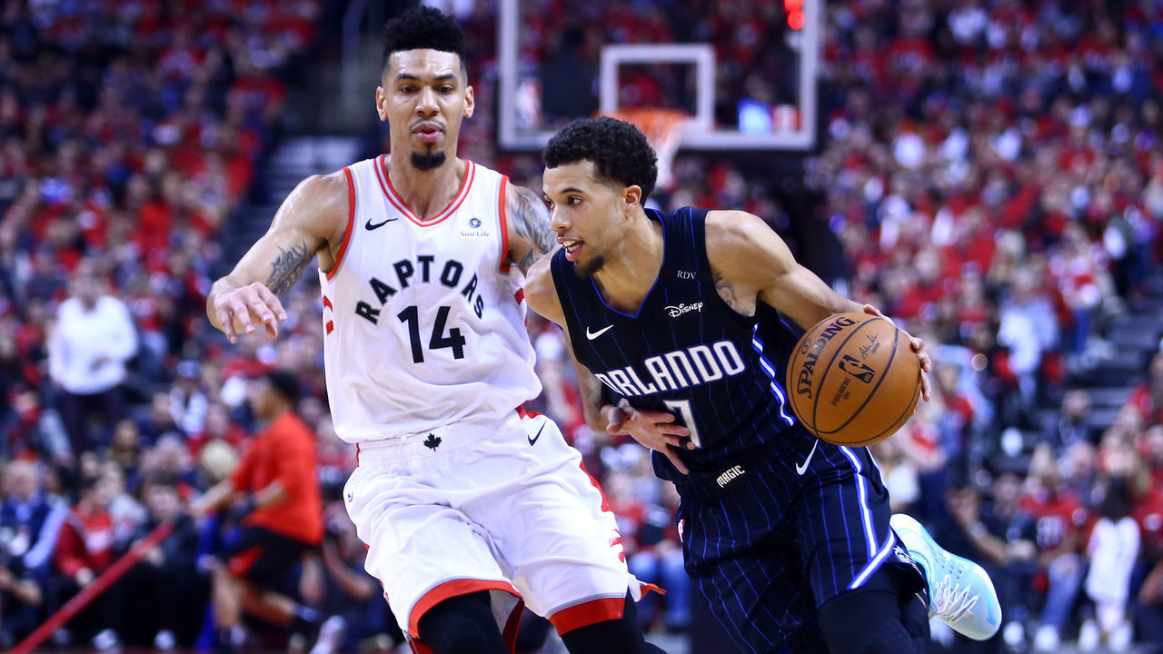 TORONTO, ON - APRIL 13: Michael Carter-Williams #7 of the Orlando Magic dribbles the ball as Danny Green #14 of the Toronto Raptors defends during Game One of the first round of the NBA playoffs at Scotiabank Arena on April 13, 2019 in Toronto, Canada.