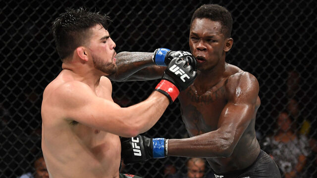 ATLANTA, GA - APRIL 13: (L-R) Kelvin Gastelum and Israel Adesanya exchange strikes in their interim middleweight championship bout during the UFC 236 event at State Farm Arena on April 13, 2019 in Atlanta, Georgia.