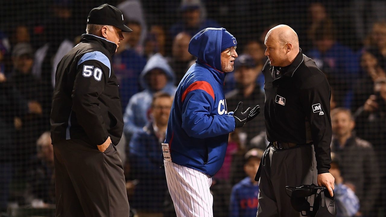 CHICAGO, ILLINOIS - APRIL 11: Manager Joe Maddon #70 of the Chicago Cubs argues a call with umpire Mike Estabrook #83 before being ejected during the fifth inning against the Pittsburgh Pirates at Wrigley Field on April 11, 2019 in Chicago, Illinois.
