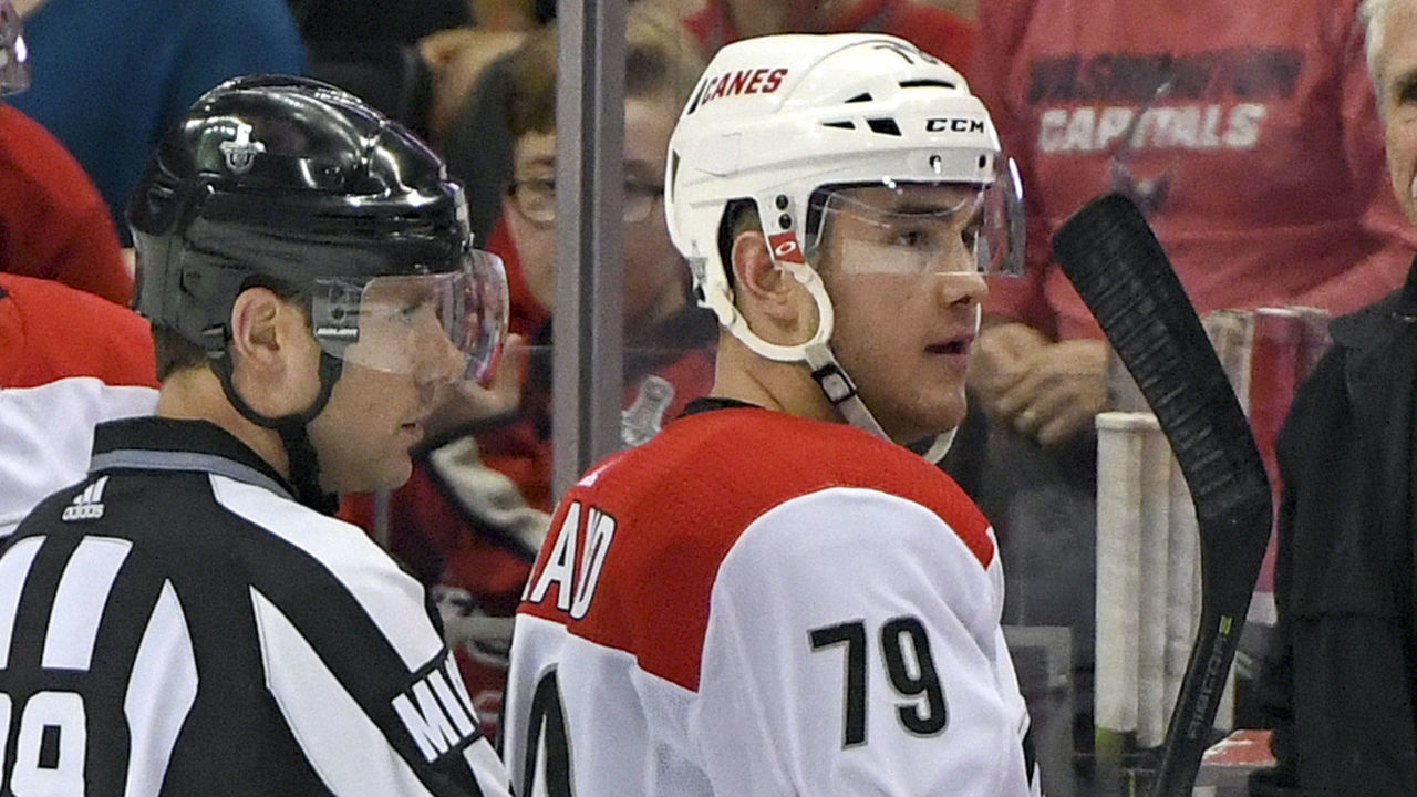 WASHINGTON, DC - APRIL 13: Carolina Hurricanes left wing Micheal Ferland (79) is escorted off the ice by linesman Kiel Murchison (79) after receiving a match penalty in the game against the Washington Capitals on April 13, 2019, at the Capital One Arena in Washington, D.C. in the first round of the Stanley Cup Playoffs.