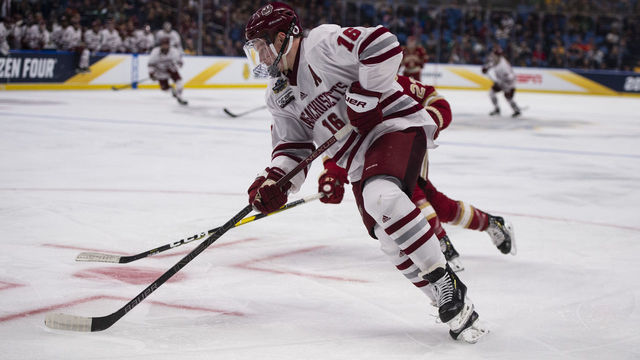 BUFFALO, NY - APRIL 11: Massachusetts Minutemen Defenseman Cale Makar (16) skates with the puck during the second period of the NCAA Hockey Frozen Four semi-final game between the Massachusetts Minutemen and the Denver Pioneers on April 11, 2019, at the Key Bank Center in Buffalo, NY.