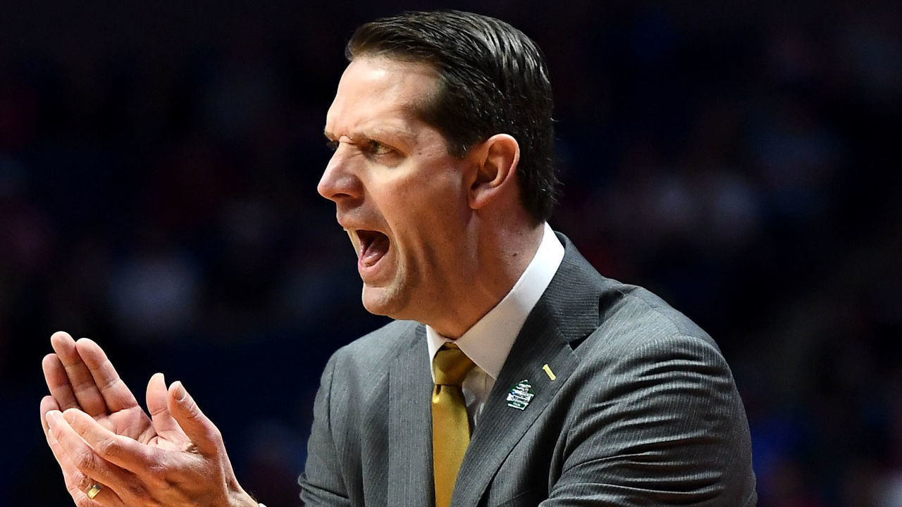 TULSA, OKLAHOMA - MARCH 22: Head coach John Brannen of the Northern Kentucky Norse cheers his team on as they play against the Texas Tech Red Raiders during the first half of the first round game of the 2019 NCAA Men's Basketball Tournament at BOK Center on March 22, 2019 in Tulsa, Oklahoma.