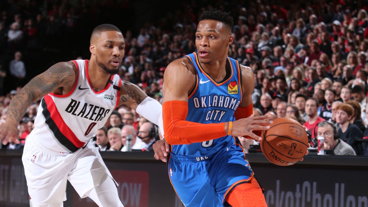 PORTLAND, OR - APRIL 14: Damian Lillard #0 of the Portland Trail Blazers defends against Russell Westbrook #0 of the Oklahoma City Thunder during Game One of Round One of the 2019 NBA Playoffs on April 14, 2019 at the Moda Center Arena in Portland, Oregon. Mandatory Copyright Notice: Copyright 2019 NBAE