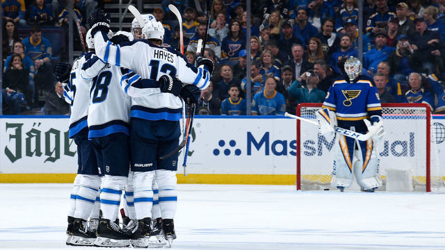 ST. LOUIS, MO - APRIL 14: Jack Roslovic #28 of the Winnipeg Jets is congratulated after scoring a goal against the Winnipeg Jets in Game Three of the Western Conference First Round during the 2019 NHL Stanley Cup Playoffs at Enterprise Center on April 14, 2019 in St. Louis, Missouri.
