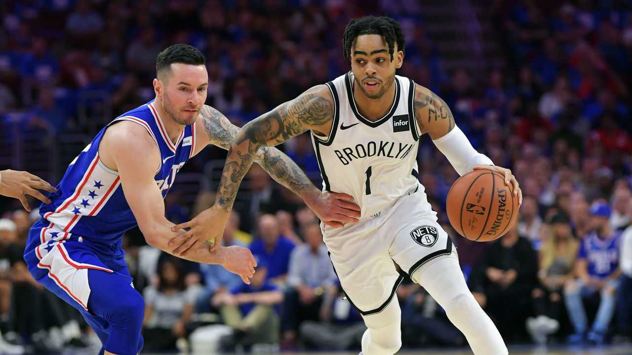 PHILADELPHIA, PA - APRIL 13: D'Angelo Russell #1 of the Brooklyn Nets drives around JJ Redick #17 of the Philadelphia 76ers in the first half during Game One of the first round of the 2019 NBA Playoff at Wells Fargo Center on April 13, 2019 in Philadelphia, Pennsylvania.