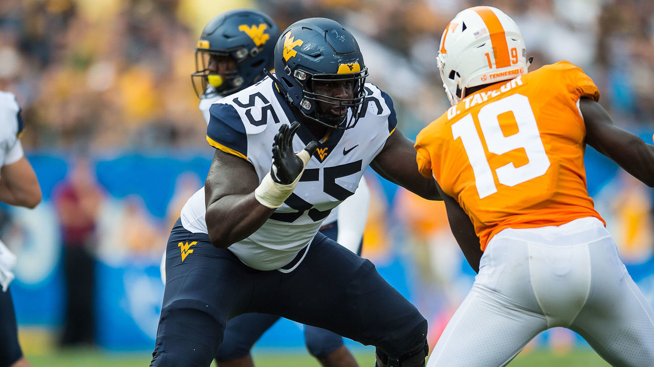 CHARLOTTE, NC - SEPTEMBER 01: West Virginia Mountaineers offensive lineman Yodny Cajuste (55) blocking Tennessee Volunteers linebacker Darrell Taylor (19) during a game between the Tennessee Volunteers and West Virginia Mountaineers on September 1, 2018, at Bank of America Stadium in Charlotte, NC.