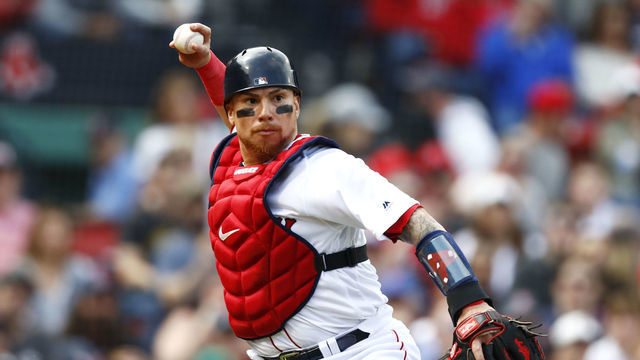 BOSTON, MASSACHUSETTS - APRIL 14: Catcher Christian Vazquez #7 of the Boston Red Sox throws to first base at the top of the fourth inning of the game against the Baltimore Orioles at Fenway Park on April 14, 2019 in Boston, Massachusetts.