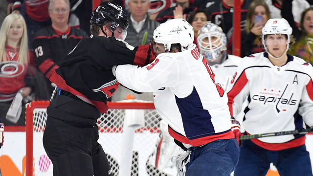 RALEIGH, NORTH CAROLINA - APRIL 15: Alex Ovechkin #8 of the Washington Capitals knocks out Andrei Svechnikov #37 of the Carolina Hurricanes as they fight during the first period in Game Three of the Eastern Conference First Round during the 2019 NHL Stanley Cup Playoffs at PNC Arena on April 15, 2019 in Raleigh, North Carolina.