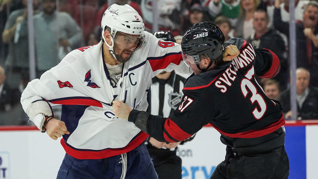 RALEIGH, NC - APRIL 15: Washington Capitals left wing Alex Ovechkin (8) and Carolina Hurricanes right wing Andrei Svechnikov (37) fight during a game between the Carolina Hurricanes and the Washington Capitals at the PNC Arena in Raleigh, NC on April 15, 2019.