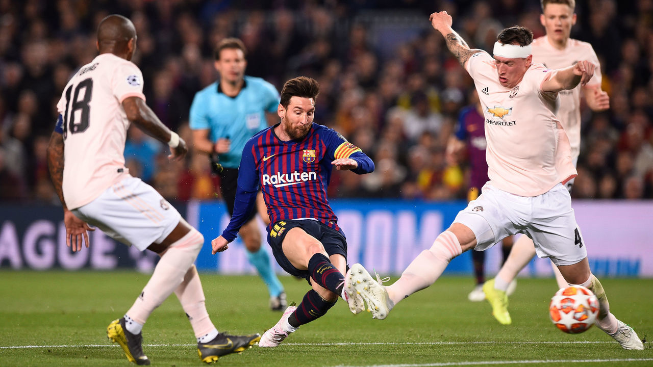 Barcelona's Argentinian forward Lionel Messi (C) scores during the UEFA Champions League quarter-final second leg football match between Barcelona and Manchester United at the Camp Nou stadium in Barcelona on April 16, 2019.