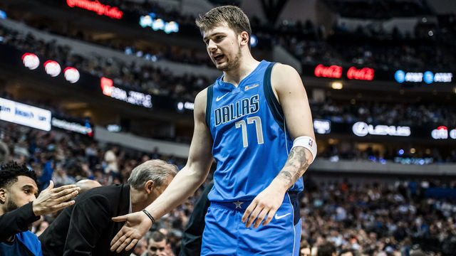 DALLAS, TX - MARCH 26: (EDITORS NOTE: Image has been digitally enhanced) Luka Doncic #77 of the Dallas Mavericks shakes hands with teammates as he walks off the court against the Sacramento Kings on March 26, 2019 at the American Airlines Center in Dallas, Texas. Mandatory Copyright Notice: Copyright 2019 NBAE
