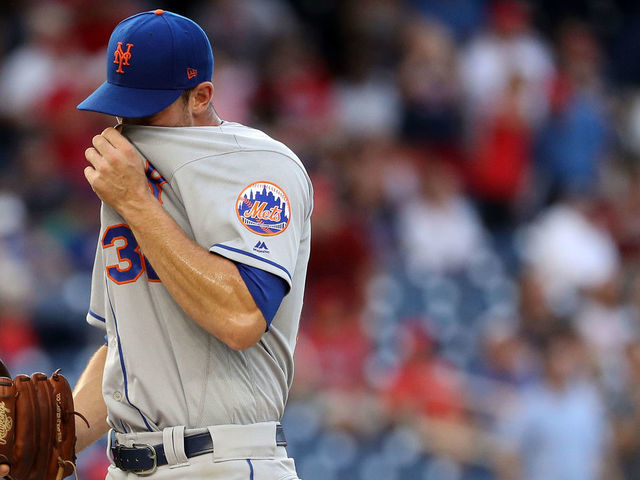 WASHINGTON, DC - JULY 31: Starting pitcher Steven Matz #32 of the New York Mets reacts after allowing a hit to Tanner Roark #57 of the Washington Nationals (not pictured) during the first inning at Nationals Park on July 31, 2018 in Washington, DC.