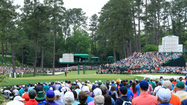 AUGUSTA, GEORGIA - APRIL 14: Patrons watch as Tiger Woods of the United States putts on the 15th green during the final round of the Masters at Augusta National Golf Club on April 14, 2019 in Augusta, Georgia.
