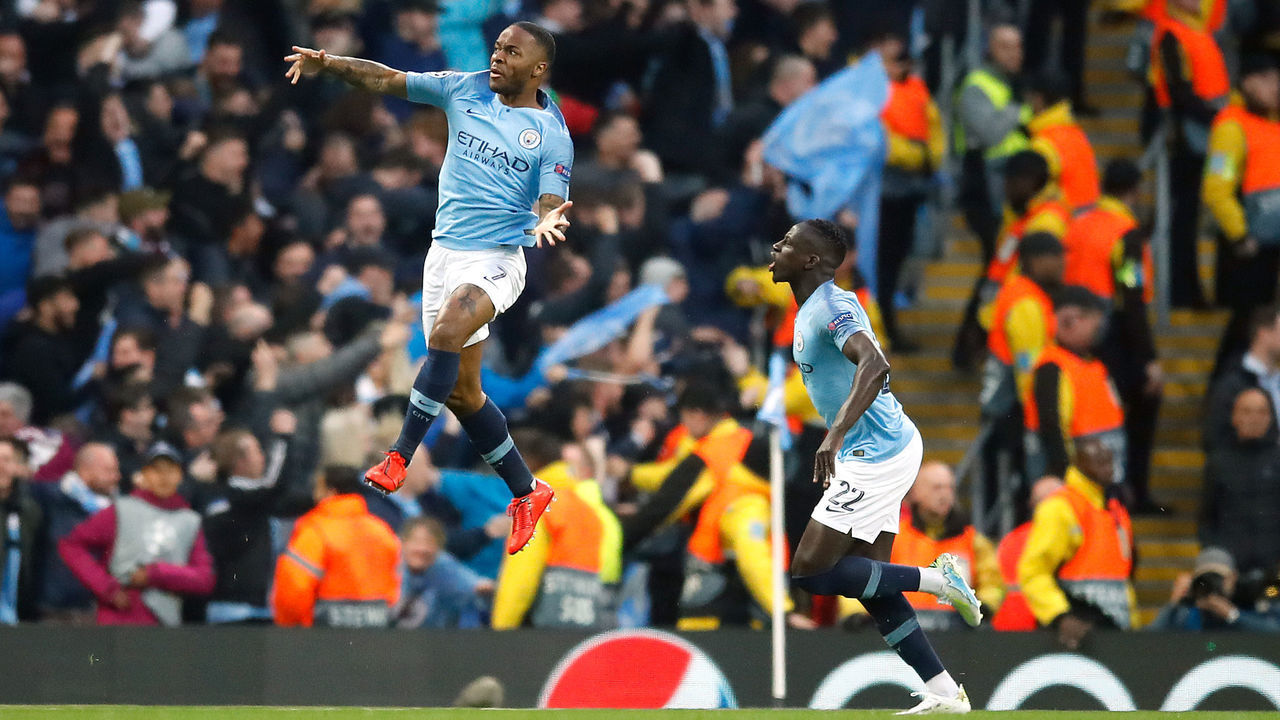 Manchester City's Raheem Sterling (left) celebrates scoring his side's first goal of the game during the UEFA Champions League quarter final second leg match at the Etihad Stadium, Manchester.