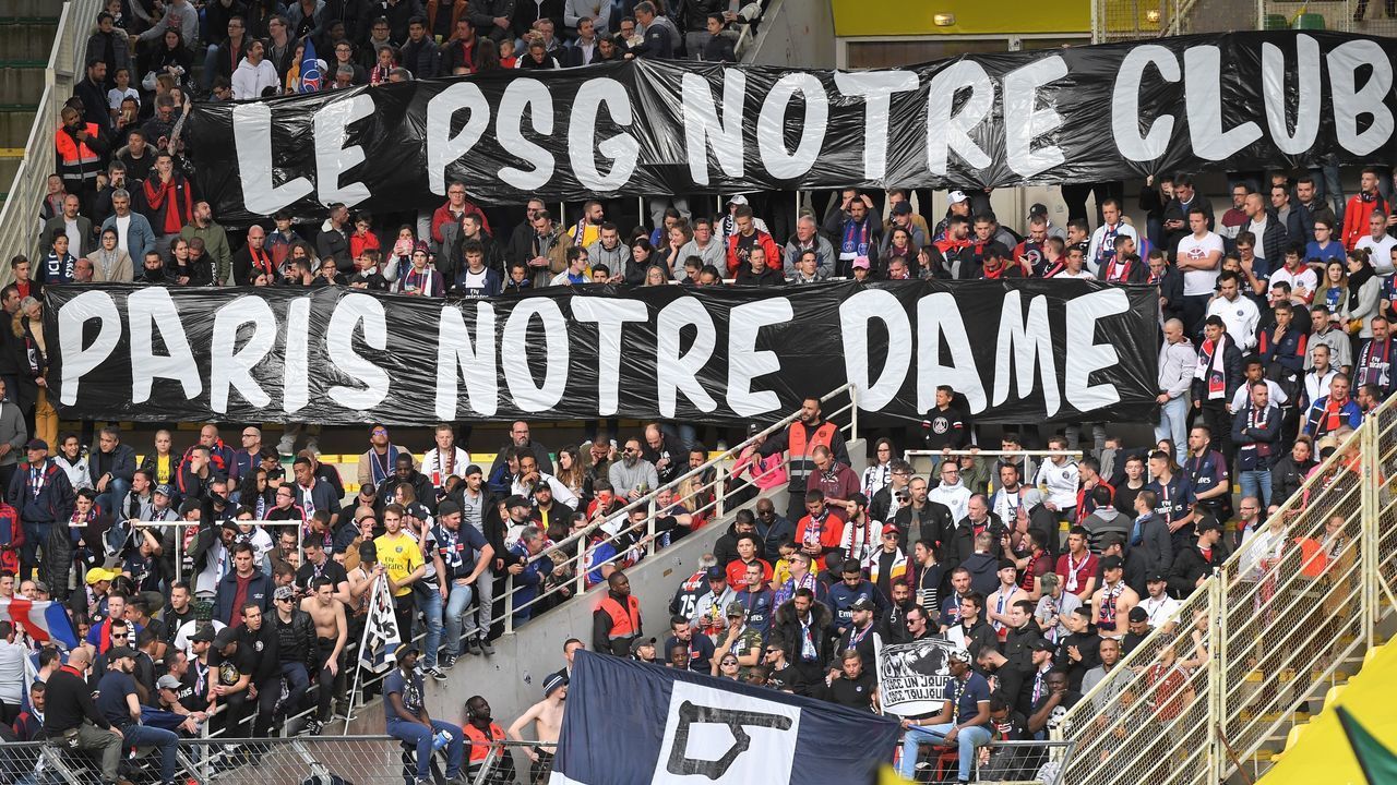 Paris Saint-Germain's supporters pay homage to Notre-Dame cathedral two days after a fire ripped through its roof, during the French L1 football match between Nantes (FC Nantes) and Paris Saint-Germain (PSG) at the La Beaujoire stadium in Nantes, western France, on April 17, 2019.