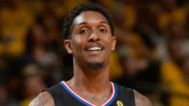 OAKLAND, CA - APRIL 15: Lou Williams #23 of the LA Clippers smiles against the Golden State Warriors during Game Two of Round One of the 2019 NBA Playoffs on April 15, 2019 at ORACLE Arena in Oakland, California. NOTE TO USER: User expressly acknowledges and agrees that, by downloading and or using this photograph, user is consenting to the terms and conditions of Getty Images License Agreement. Mandatory Copyright Notice: Copyright 2019 NBAE