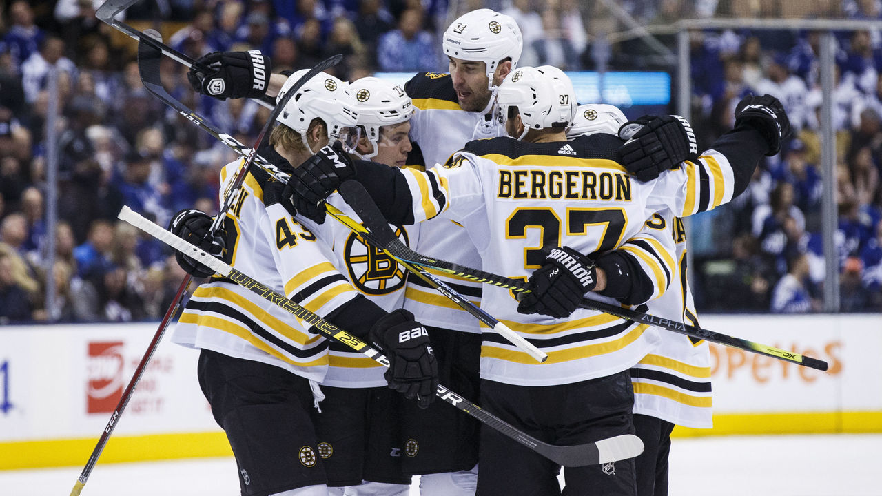 TORONTO, ON - APRIL 17: Zdeno Chara #33 of the Boston Bruins celebrates his goal against the Toronto Maple Leafs with teammates Danton Heinen #43 and Patrice Bergeron #37 during the third period during Game Four of the Eastern Conference First Round during the 2019 NHL Stanley Cup Playoffs at the Scotiabank Arena on April 17, 2019 in Toronto, Ontario, Canada.