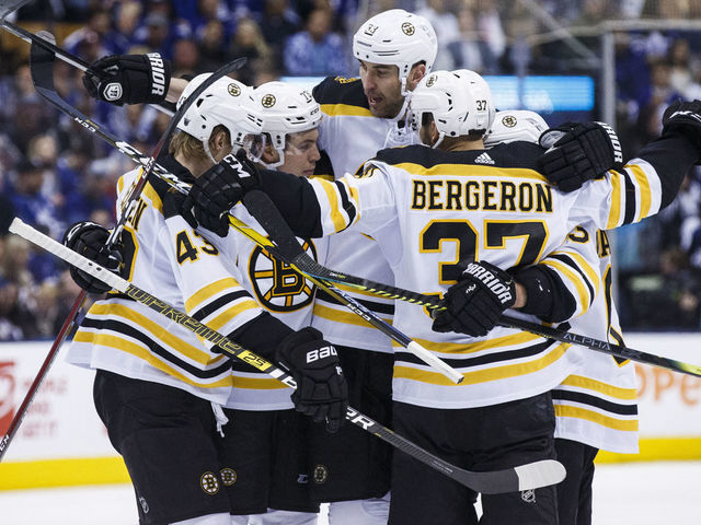 TORONTO, ON - APRIL 17: Zdeno Chara #33 of the Boston Bruins celebrates his goal against the Toronto Maple Leafs with teammates Danton Heinen #43 and Patrice Bergeron #37 during the third period during Game Four of the Eastern Conference First Round during the 2019 NHL Stanley Cup Playoffs at the Scotiabank Arena on April 17, 2019 in Toronto, Ontario, Canada.