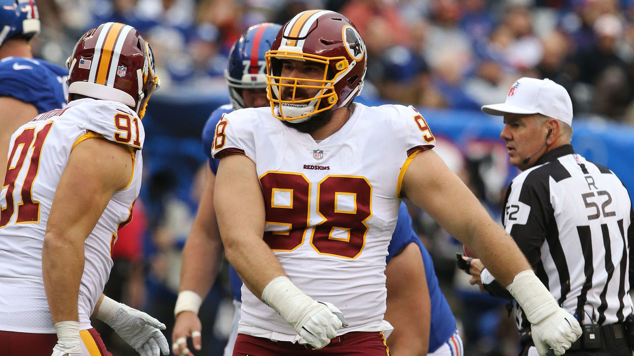 EAST RUTHERFORD, NJ - OCTOBER 28: Defensive Lineman Matt Ioannidis #98 of the Washington Redskins sacks quarterback Eli Manning #10 of the New York Giants during their game at MetLife Stadium on October 28, 2018 in East Rutherford, New Jersey.