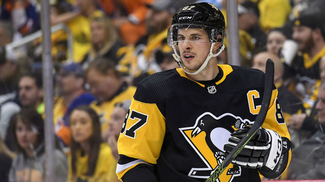 PITTSBURGH, PA - APRIL 16: Pittsburgh Penguins center Sidney Crosby (87) looks on during the third period in Game 4 of the First Round in the 2019 NHL Stanley Cup Playoffs between the New York Islanders and the Pittsburgh Penguins on April 16, 2019, at PPG Paints Arena in Pittsburgh, PA. The New York Islanders won the series 4-0.