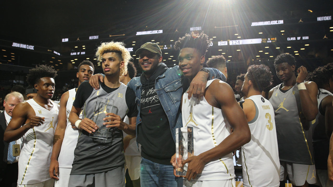 NEW YORK, NEW YORK - April 14: Carmelo Anthony of the New York Knicks with Brian Bowen #30 and Lonnie Walker Jr. #15 Miami during presentations after the Jordan Brand Classic, National Boys Team All-Star basketball game at The Barclays Center on April 14, 2017 in New York City.