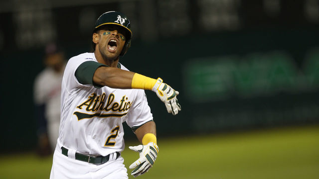 OAKLAND, CA - APRIL 1: Khris Davis #2 of the Oakland Athletics salutes while running the bases after hitting a home run during the game against the Boston Red Sox at the Oakland-Alameda County Coliseum on April 1, 2019 in Oakland, California. The Athletics defeated the Red Sox 7-0.